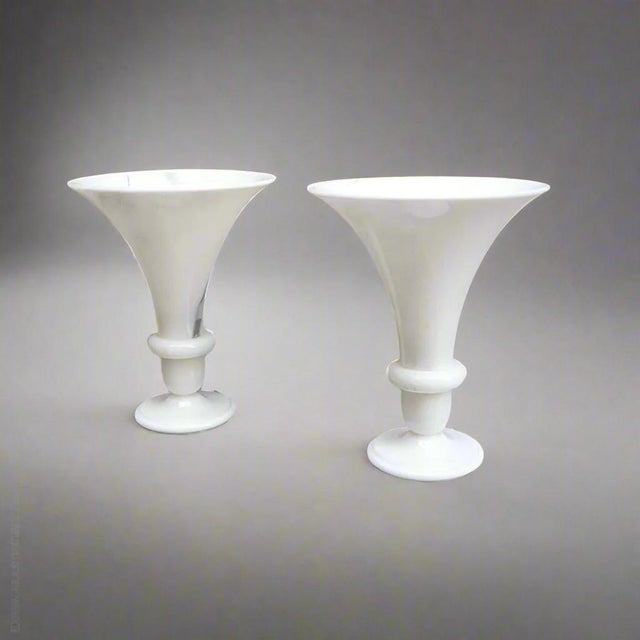A pair of polished marble urn shaped table lamps.