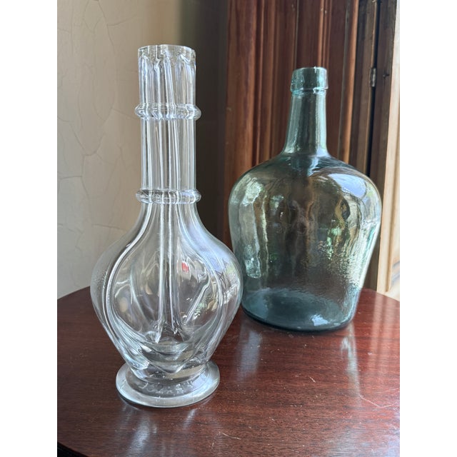 Mid century modern four chamber liqueur decanter made in France, dating to the 1960s to 1970s. Clear glass bar bottle with...