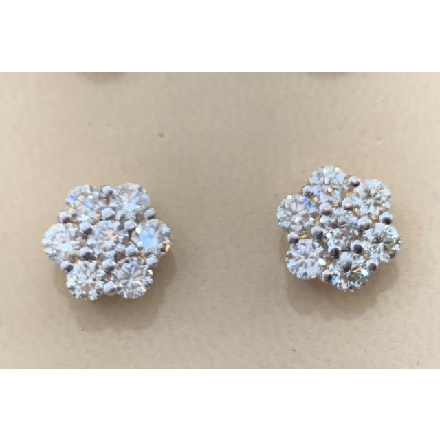 A sweet, shimmery style for any day of the week. These stud earrings blossom floral clusters of 1.75 ct. in each earring,...