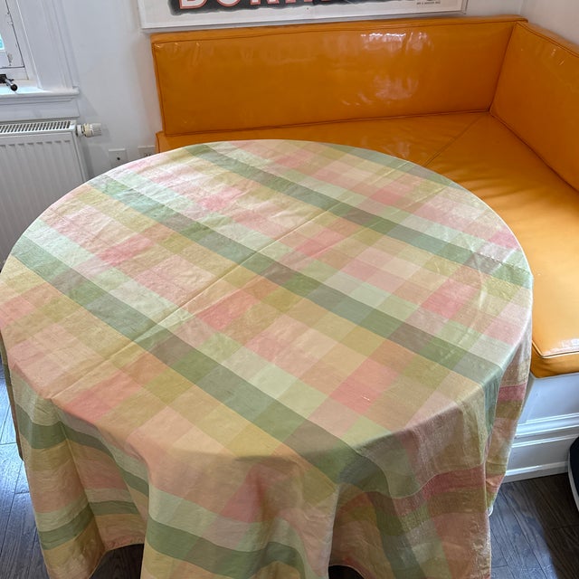 A beautiful silk taffeta plaid round table cloth made out of the most exquisite fabric and is well made. The colors are...