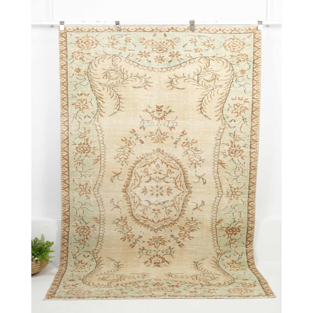 Vintage Turkish Hand-Knotted vintage rug is a semi-antique vintage Area rug.'70s Eastern region of Turkey's unique rug is...