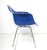 A bright blue fiberglass arm shell chair with aluminum H base having plastic foot glides to protect your floors. Designed...