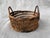 Small round, vintage, open woven basket with two top side handles. Basket measures 5 1/4" in diameter by 3 3/8" in height....