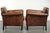 This interesting set of two Art Deco-style sheepskin armchairs has a lovely vintage look. The armchairs feature a...