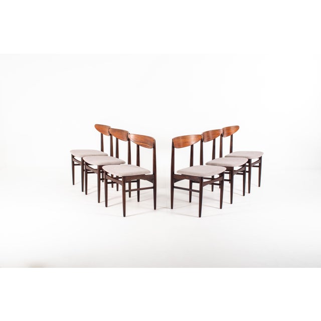 Set of six Danish dining chairs crafted in Bolivian rosewood in Denmark during the 1960s. These chairs feature elegant...