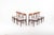Set of six Danish dining chairs crafted in Bolivian rosewood in Denmark during the 1960s. These chairs feature elegant...