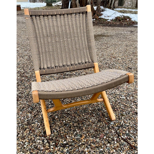 Create an aura of natural relaxation with this major design element for any room. This mid-century modern Hans Wegner...