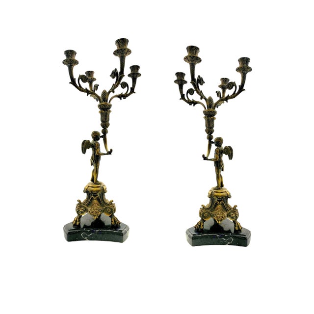 Stunning cherub angels in bronze on marble bases. Empire-style romance for mantels and dining tables. Condition: In good...