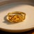 Cushion Citrine Trio Ring in Gold Warm and radiant, this ring features three natural citrine gemstones set in smooth gold...