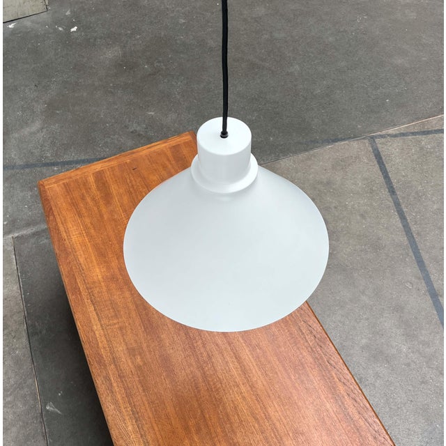 A simple pendant lamp from the danish manufacturer nordisk solar. a minimalist design. The lamp consists of a conical...