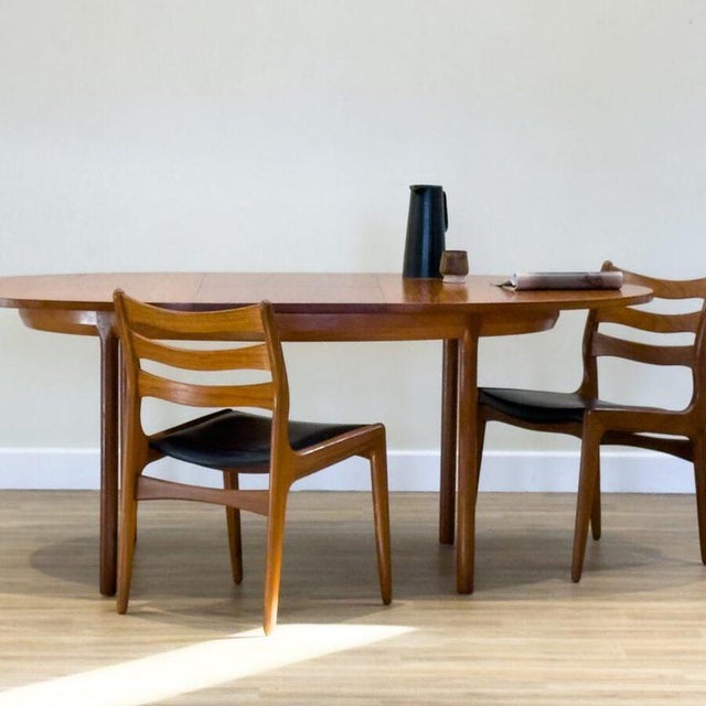 A beautifully designed mid-century oval dining table by White & Newton of Portsmouth , one of the respected British...