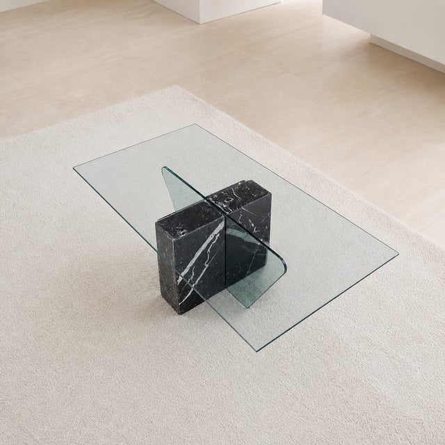Bring timeless design into your home with this Postmodern coffee table in black marble and glass. Design Highlights: A...