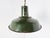 Vintage industrial pendant lights in dark green enamel. The lamps emit a soft light thanks to the white enamelled finish...