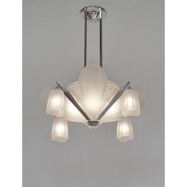 Cleopatra chandelier by H. Petitot A large French 1933 art deco chandelier in chromed brass or bronze by the famous Paris...