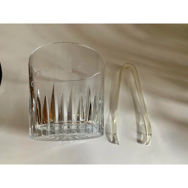 Princess House Crystal Ice Bucket with plastic tongs. The glass bucket is 5 3/4” tall. This is heavy thick glass about 6”...