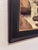 The painting depicts a dynamic river rushing through a rocky landscape, with water cascading energetically over smooth...