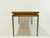 Elegant vintage coffee table from the 1960s with a high-quality walnut surface and a floating glass top. The clean lines,...