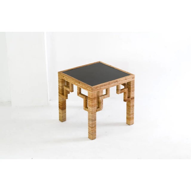 Introducing our Rattan Side Table with Black Laquered top and the legs are wrap with natural cane rattan, this piece of...