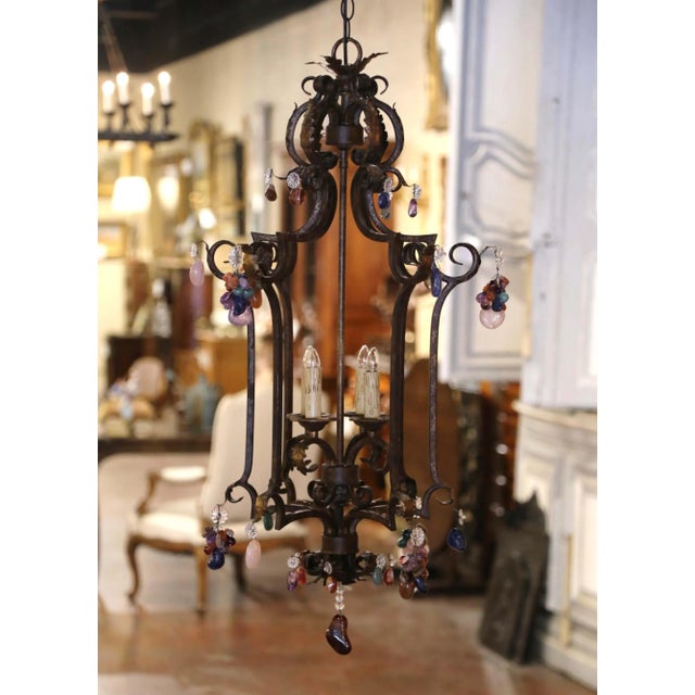 Crafted in France circa 1970, this tall square-form ceiling lantern combines an architectural wrought iron frame with...