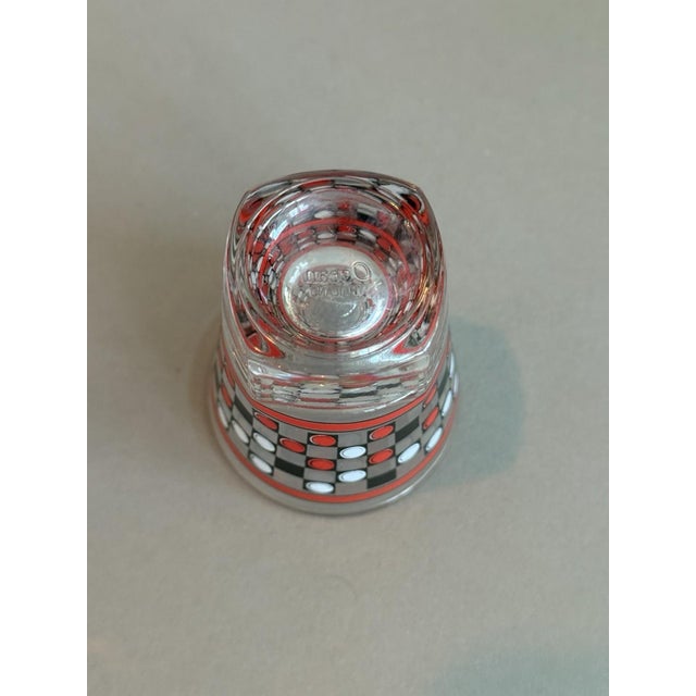 This vintage Art Deco red, white, and black checkered shot glass is a unique and stylish addition to any barware...