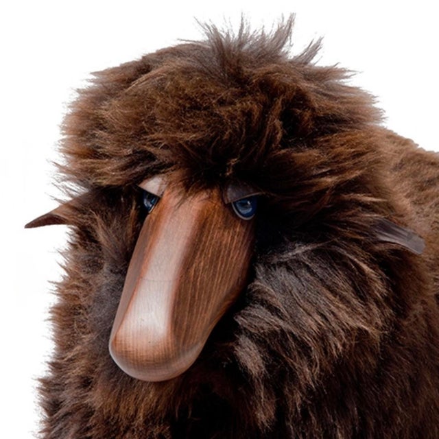 Equal parts iconic and adorable, this life-sized Lalanne-style sheep is made of wood with leather ears and brown fur....