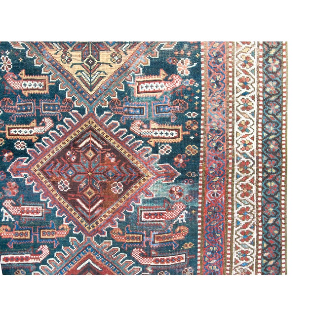 A beautiful early 20th century Persian Qashqai runner with the most wonderful tribal pattern with seven large diamond...