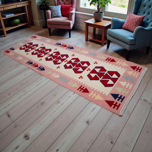 Handwoven in the Oushak region of Western Turkey in the 1990s, this long kilim runner brings a joyful, graphic presence to...