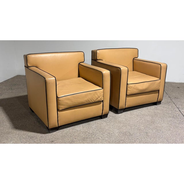 Sensational butterscotch leather club armchairs. In the style of Ralph Lauren or Jean Michel Frank. Chairs are unsigned....