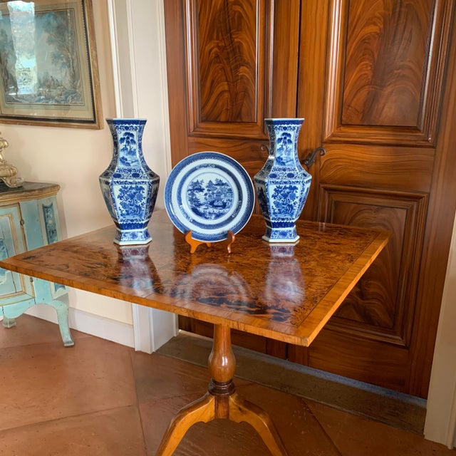 A pair of Chinese baluster vases together with an earlier Nanking Chinese export blue and white dish. The vases are an...