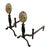 A vintage pair of Virginia Metalcrafters brass and iron andirons, featuring floral rosette medallions, vine‑incised iron...