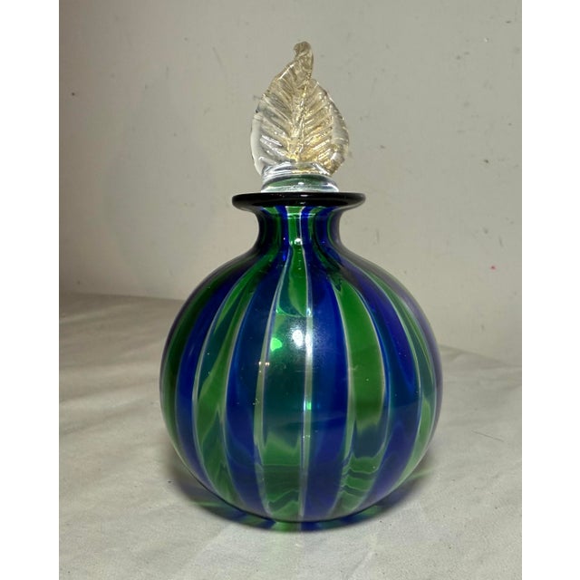This vintage hand-blown Italian Murano glass scent bottle is a unique and elegant piece of decorative glass. Made in Italy...