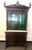 Wonderful ornately carved display cabinet, with some character marks and repair to the crest (see photos). Claw feet,...