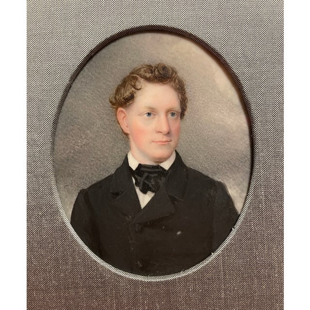 Antique 19th century portrait miniature of a man, watercolor on a thin sheet of bone, framed in a faux wood grain modern...