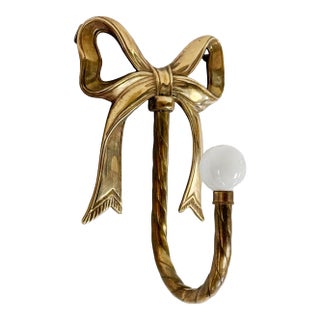 Vintage Brass Bow Wall Hook With Ceramic Knob For Sale