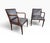 A stylish pair of Vintage Hollywood Regency faux bamboo armchairs, circa 1970s, featuring elegant sculpted frames and a...