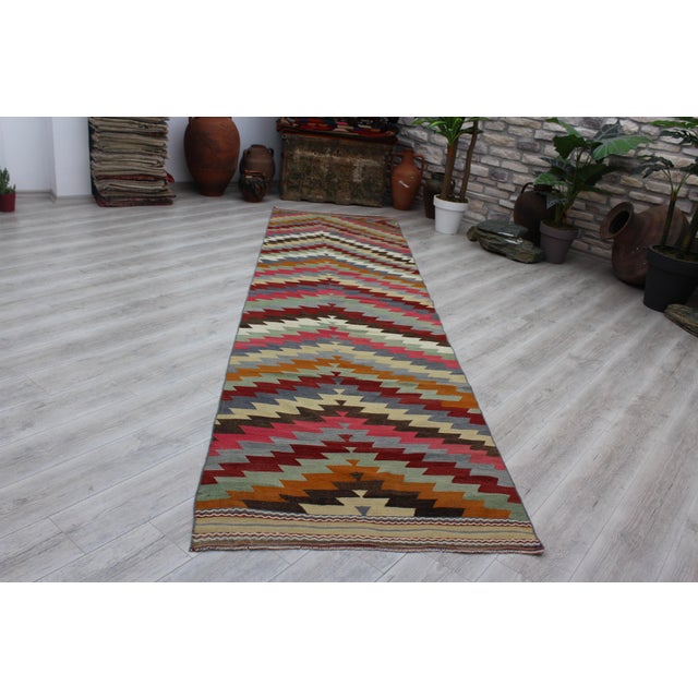 This beautiful, vintage, handwoven traditional Turkish Kilim is approximately 60 years old. It is handmade of very fine...