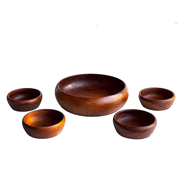 Offered is a set of 5 hand-turned Teak wood bowls. They are a blend of what we refer to as the bubble shape and the more...