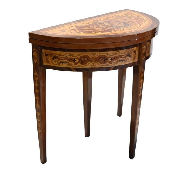Elegant french louis xvi style games table with extensive floral marquetry demi-lune top decorated with flowers scrolling...
