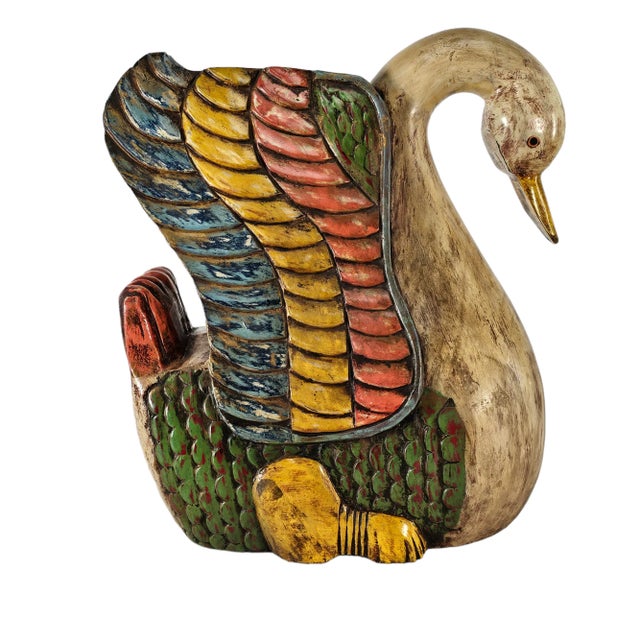 A striking late 20th-century Mexican folk art swan, hand-carved from solid wood and painted in vibrant tones of red,...