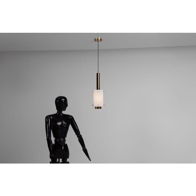 Rare set of three pendant lamps designed and manufactured by Stilnovo, Italy 1960s. These elegant mid-century pendants...