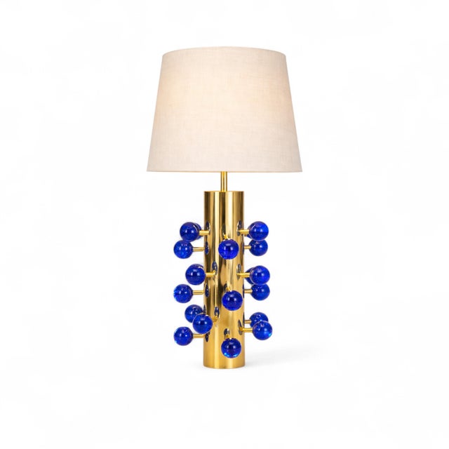 This pair of Italian table lamps is entirely handmade by Justfurnituress, combining polished brass with vibrant blue...