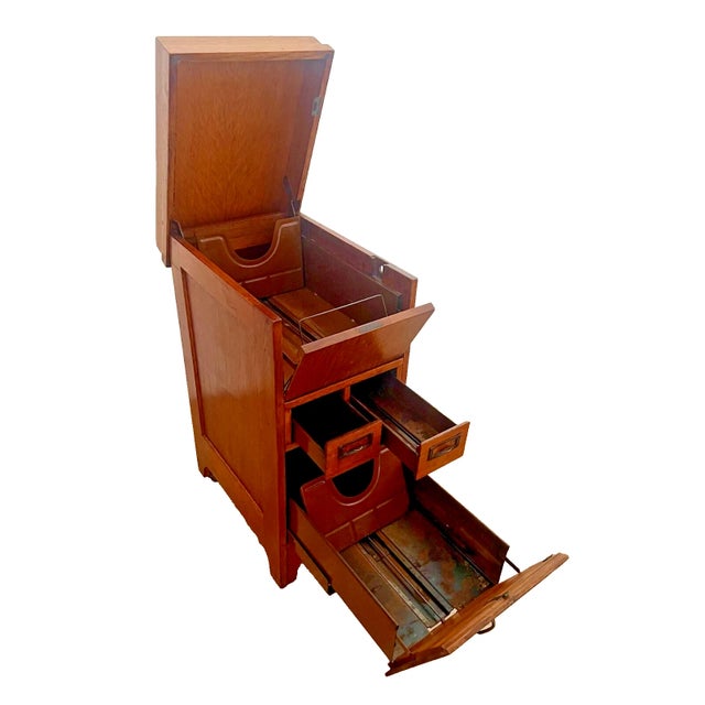 Gorgeous and Rare Antique File Cabinet with Tilt Open Top, Two Index Card drawers, Paneled Sides and Wood Caster wheels....