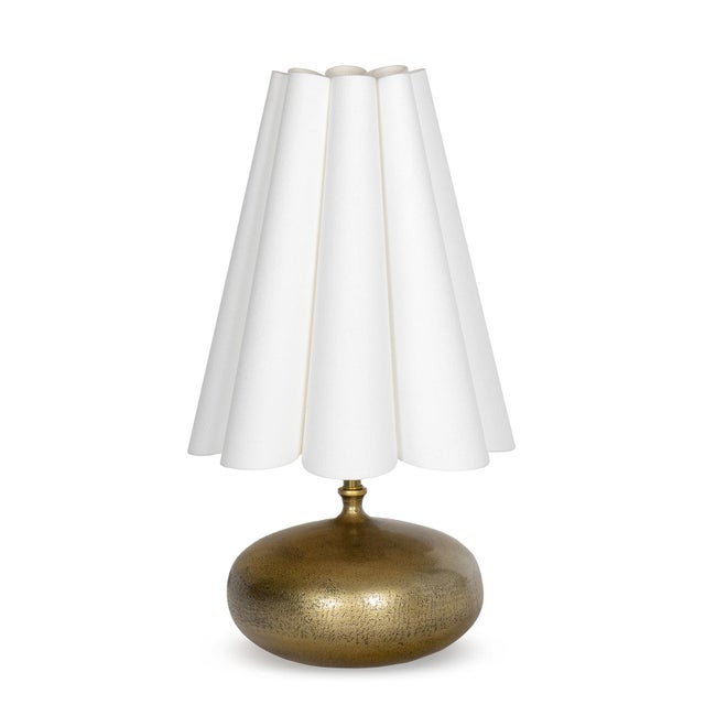 The Cassidy Mini Lamp pairs a compact form with a confident presence. Its sculptural orb base, cast in metal and finished...