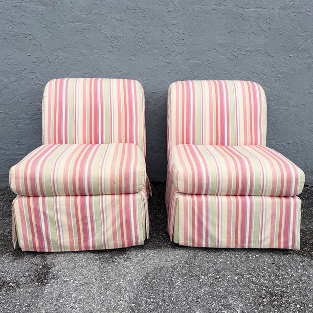 This pair of vintage coastal Regency lounge chairs brings cheerful color and tailored comfort to any room. Each armless...