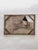 This artwork presents a reclining figure, rendered with a combination of oil and graphite, creating a striking interplay...