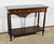 This solid and plated mahogany console opens on a belt by a large drawer with two folding handles with functional original...