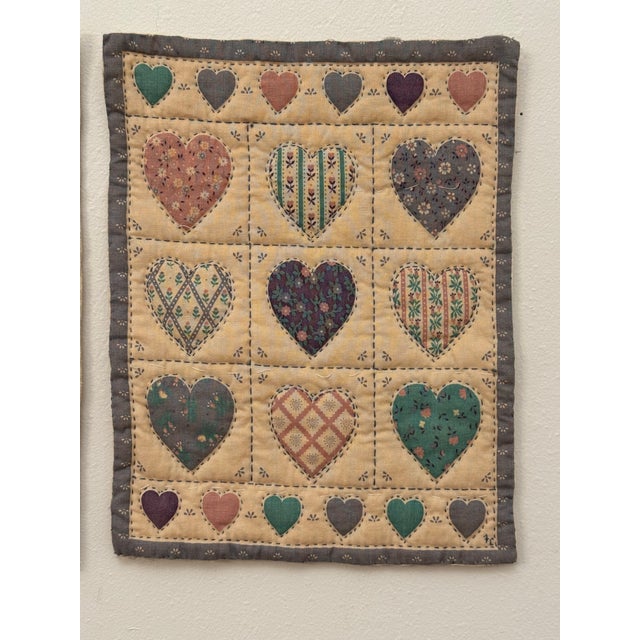 :Amongst this pair of hand-stitched vintage quilt textile art pieces are gabric shapes (bears and hearts) which have been...