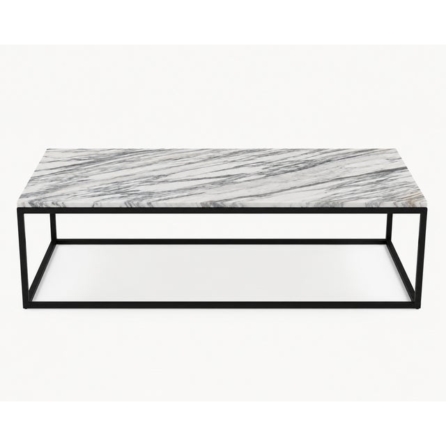 A beautifully proportioned contemporary coffee table featuring a substantial genuine Calacatta Vagli marble top resting on...