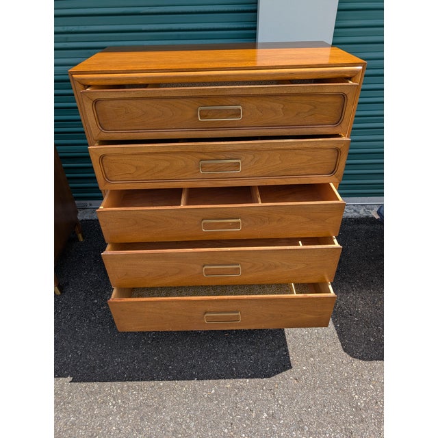 Attractive highboy dresser from the Drexel Cascade bedroom set line. Walnut finish with a lovely defined grain, metal...