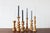 A decorative set of six vintage wooden candleholders, designed in the style of mid-20th-century Scandinavian design. All...